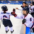 GANGNEUNG, SOUTH KOREA - FEBRUARY 20: Korea's Jongah Park #9 high fives Yujung Choi #6 after a first period goal scored by Soojin Han #17 (not shown) on Team Sweden during classification round action at the PyeongChang 2018 Olympic Winter Games. (Photo by Matt Zambonin/HHOF-IIHF Images)

